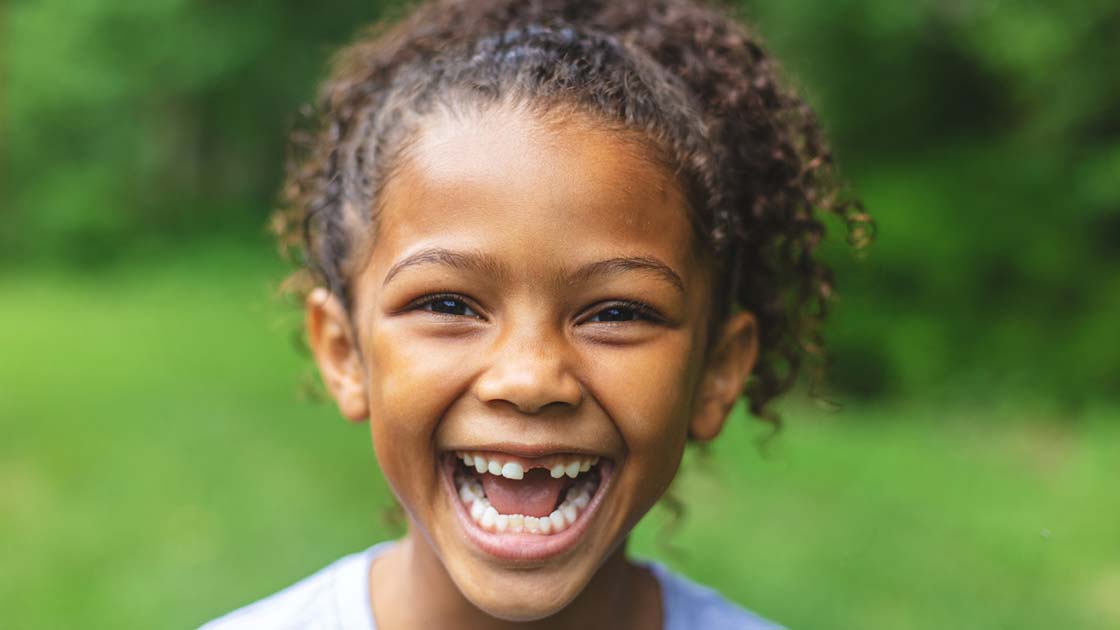 happy girl missing tooth